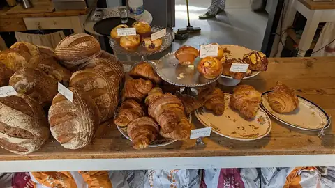 Sourdough and croissants on a counter